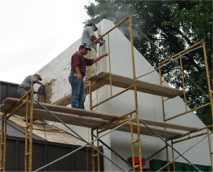 Old stucco is stripped off
