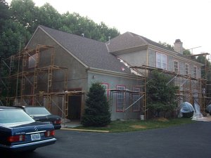 Brown coat on garage