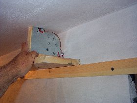 A wooden track is screwed to a chalk line