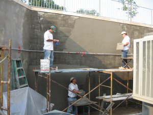 Mortar is bonded to the concrete