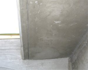 Drip groove is scored in brown coat on ceiling
