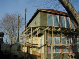 Brown coat on back of
house.