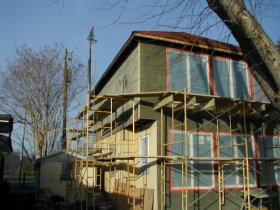 Brown coat on back of
                house.