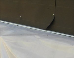 Tar paper overlaps flashing