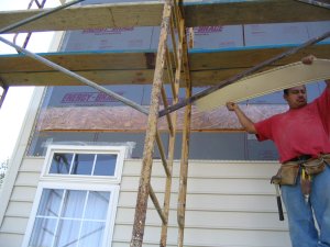 Siding off, stucco on