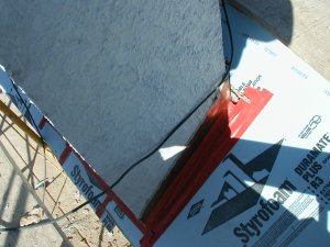 A good use for styrofoam is protecting this
              slate roof from falling debris