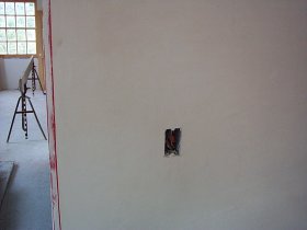 White coat is applied flush to the jamb