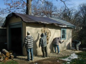 Lath and stucco torn
                off this garage