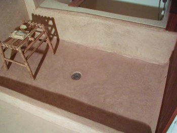 Shower floor has a stone like finish