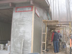 Brown coat on side wall