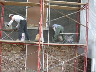 stucco on old brick