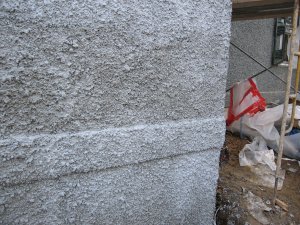 A plastic tent and heaters allow work to proceed during sub-freezing temperatures