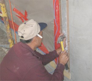 Metal lath is nailed to the brown coat. This is insurance my window
surrounds will never fall off.