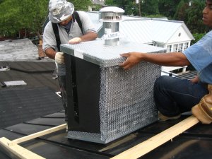 Metal cap is covered with lath and stucco