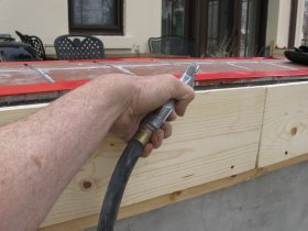 Scratch coat is wet with a hose