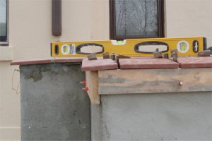cap prevents
            water from filtering in the stucco on the top