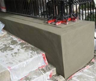 brown coat on knee wall