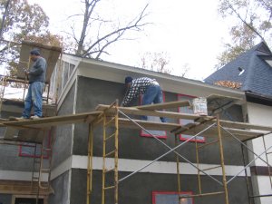 straightening the wall with a straight edge.