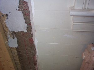 plaster is scored to look like ceramic tile