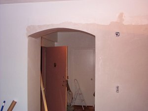 Finished plaster arch and kitchen