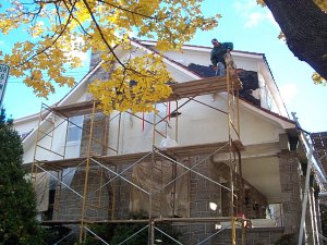 Old stucco
              torn off on gables and dormer