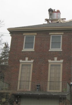 Chimney cap color matches the retaining wall