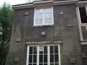 pebble dash stucco with exposed stones