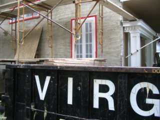 scaffold is built on top of the dumpster