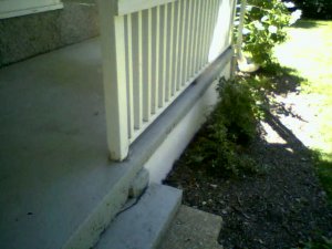 Old ragged looking concrete is recoated with new stucco