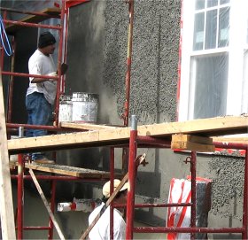 Pebble dash stucco on new house