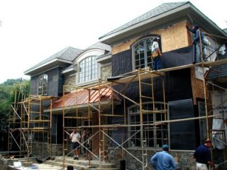 Tyvek torn off, tarpaper on