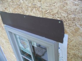 flashing over window flange