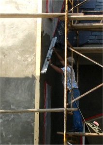 brown coat at roof line